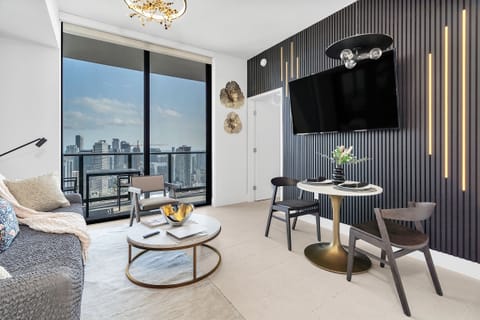 A beautiful view of the city and the bay opens up from the living room.