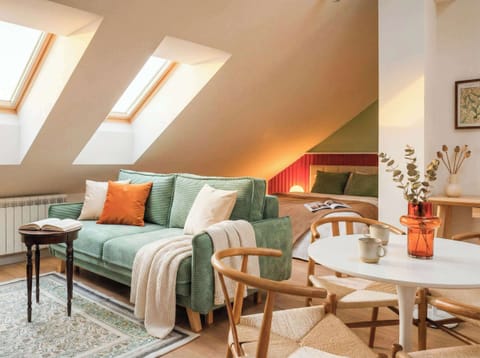 Apartment with queen size bed and convertible sofa bed. Roof windows guarantee lots of natural light during day, blackout blinds guarantee impermeability of light during night. 