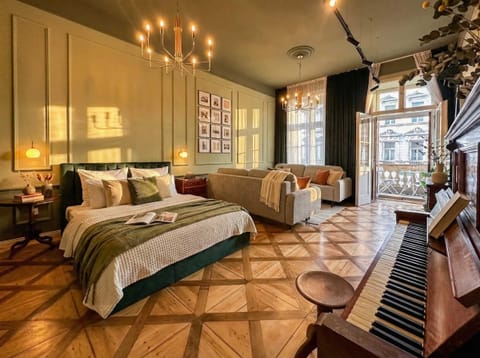 Photo of the main bedroom with queen size bed and two convertible sofa beds