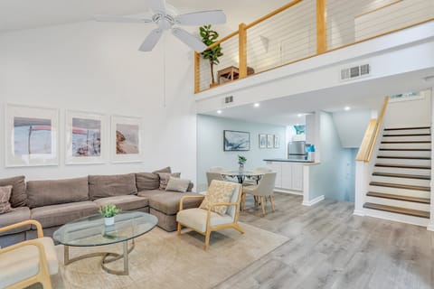 Spacious living room with flat screen tv and sleeper sofa.