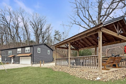 Garage doors open up so family and friends can enjoy the inside games and the pond amenities together