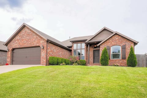 Welcome to your home away from home! This charming brick exterior and manicured lawn set the stage for a stylish, comfortable stay near XNA.