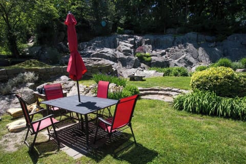 Spacious backyard oasis with comfortable seating and greenery. 