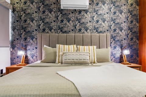 Relax in style in this elegant and inviting bedroom, designed for maximum comfort and privacy. Enjoy a restful night's sleep in the luxurious king-size bed with premium linens and pillows.