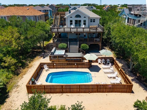 Experience the ultimate coastal getaway at Back at the Banks, a beautiful 4-bedroom, 3-bathroom professionally decorated vacation home located in the heart of Corolla.