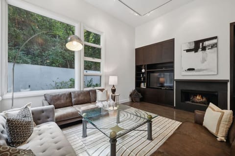 Family Room with ample seating, Smart TV, fireplace and more