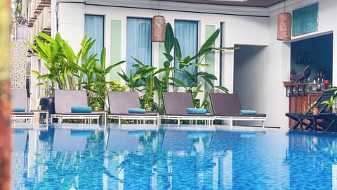Outdoor pool, open 9:00 AM to 9:00 PM, free cabanas, pool umbrellas