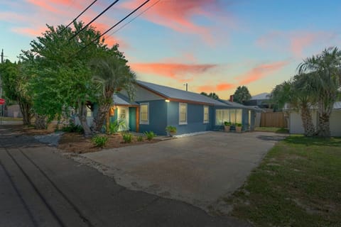 A lovely outside view of the house, with a serene sky and a long, spacious landscape that creates a peaceful atmosphere.