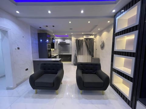 Family Room, Balcony, City View | Living area | Flat-screen TV, video-game console