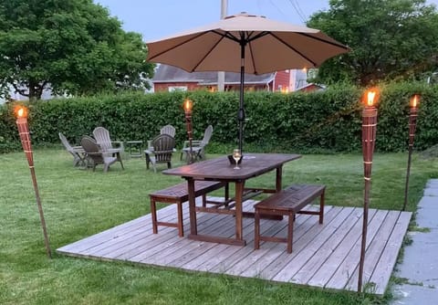 Large backyard with grill, dining table & chairs 
Cozy fire pit with 6 chairs