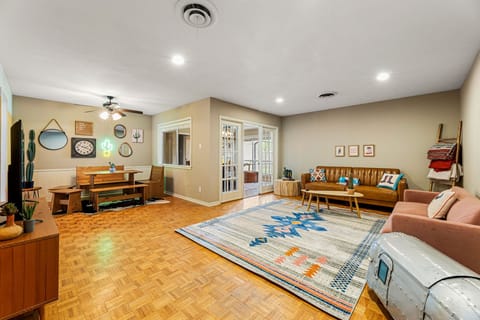 Spacious living room with 2 plush couches, and multi purpose seating corner