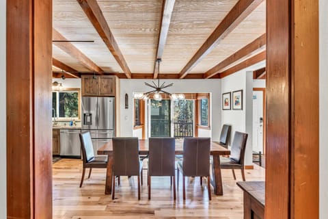 Dining Room: 9-person dining table, open layout to kitchen and living room