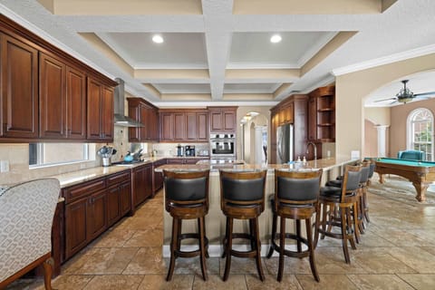 Whip up your favorite meals in this fully stocked kitchen with a large island and high seating—perfect for casual dining and conversation