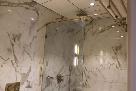 Shower, hair dryer, slippers, towels