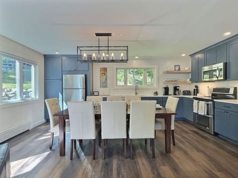 Functional kitchen and cozy dining space combined for easy mealtime flow.