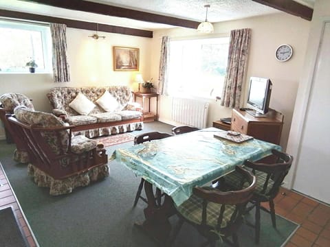 Kitchen table and four chairs. Large sofa and two armchairs