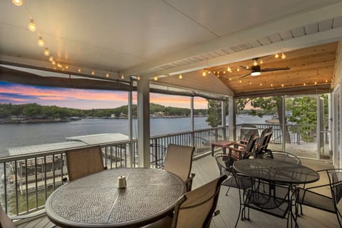 Relax on the screened-in deck with stunning lake views and cozy string lights, perfect for sunset dinners or morning coffee!