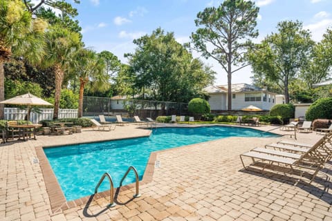 Island Retreat has a beautiful pool with plenty of tables and lounge chairs.  A tennis/pickleball court is also available for your use.