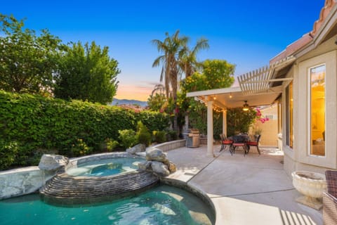 Unwind in the spa, dine under the covered patio, and enjoy peaceful desert evenings surrounded by lush greenery and warm sunset skies.