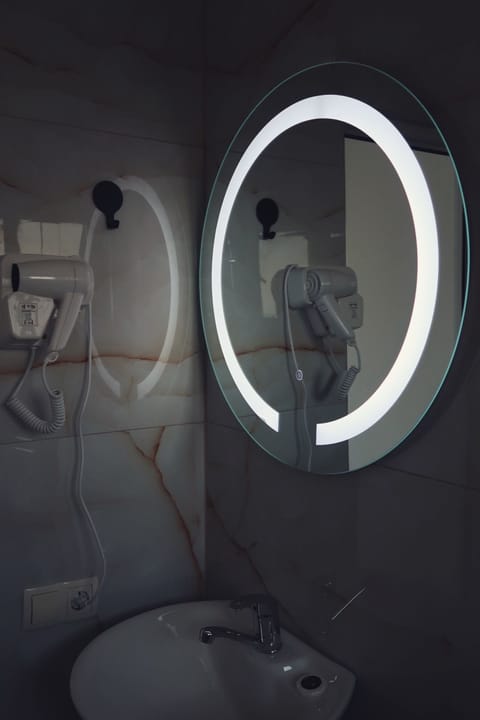 Shower, hair dryer, slippers, towels