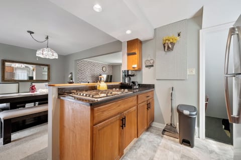 Stove top, coffee/tea maker, pots, pans and silverware storage