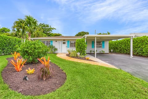 Welcome to your sunny escape!  Step into a world of vibrant charm and relaxed comfort. This inviting home, with its bright accents and lush landscaping, is ready to be your personal haven.