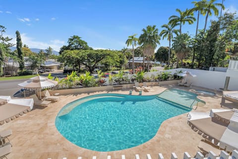The tropical-style swimming pool is perfect for cooling off or unwinding on the sun loungers with a good book.