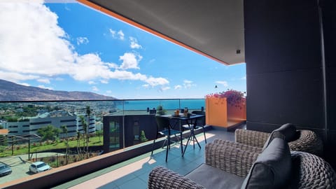 Blissful Suite by LovelyStay in Funchal, Madeira offers stunning ocean, mountain, and bay views. This modern, luxurious apartment features AC, free WiFi, parking, a condominium pool, children's playground, and a prime location. #balcony