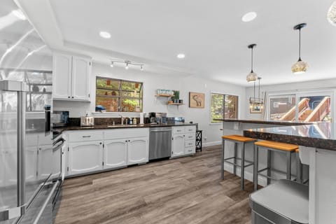 Kitchen with Bar top seating for 3
