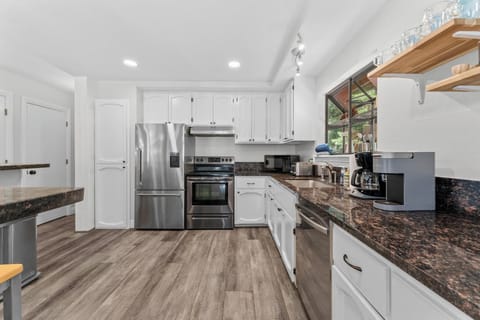 Kitchen with open concept into the living room and dining area. 