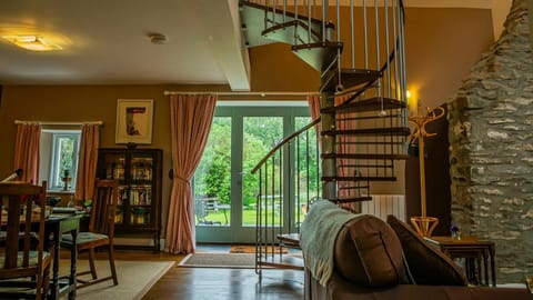Spiral staircase and French doors leading to the garden
