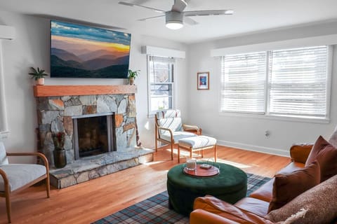 Curl up by the stone fireplace for movie night or just enjoy the way afternoon light fills this bright, airy space - there`s room to spread out however you like