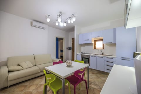 Apartment, 2 Bedrooms, Balcony | Living area | Flat-screen TV