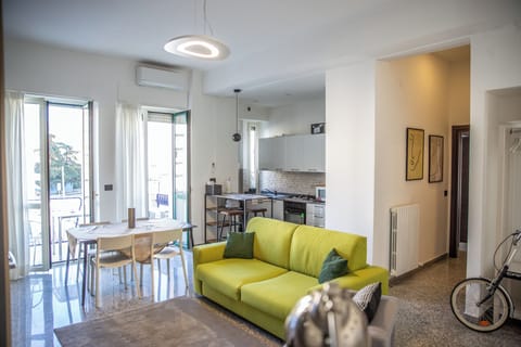 Apartment, 2 Bedrooms, Balcony | Living area | Flat-screen TV