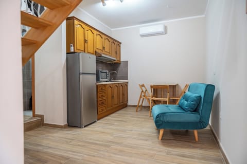 Apartment, 1 Bedroom, Kitchen | Living area | Flat-screen TV