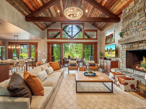 Living Room With Stone Gas Fireplace + Floor-To-Ceiling Views + Large Seating