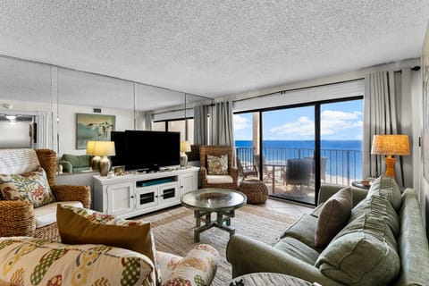 Relax in this coastal living room with ocean views and natural light.