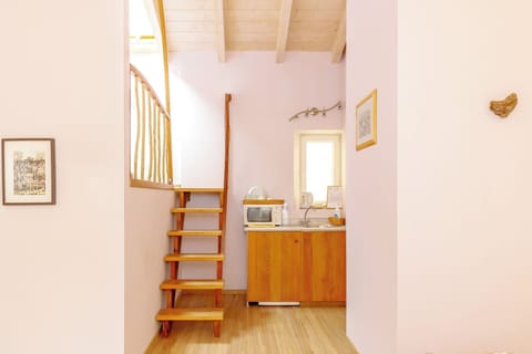 Deluxe Quadruple Room | In-room safe, desk, blackout drapes, soundproofing