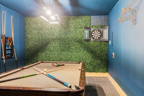 Have fun in the garage, converted into a game room for pool and darts!