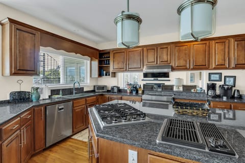 Elevate your cooking experience with high-end stainless appliances and ample cabinetry