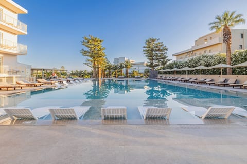 Outdoor pool, open 10 AM to 6:00 PM, pool umbrellas, sun loungers