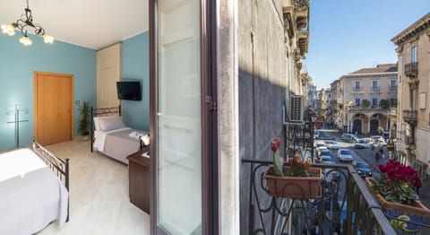 Panoramic Quadruple Room, City View | Balcony view