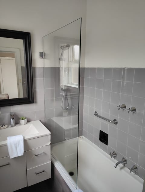 Deluxe Suite, 2 Bedrooms | Bathroom | Combined shower/tub, hair dryer, towels, soap