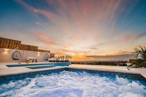 Imagine yourself sitting on in your heated jacuzzi, enjoying the sunset view. The patio features a heated Jacuzzi and an infinity pool.