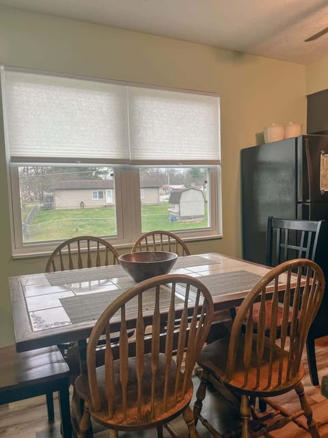Dining Area: Bright and inviting space for meals, featuring a charming wooden table and scenic views!