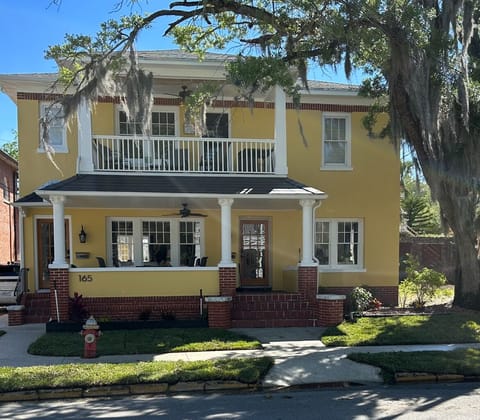 Apartment is accessible via the door on the left and up one flight of stairs.
