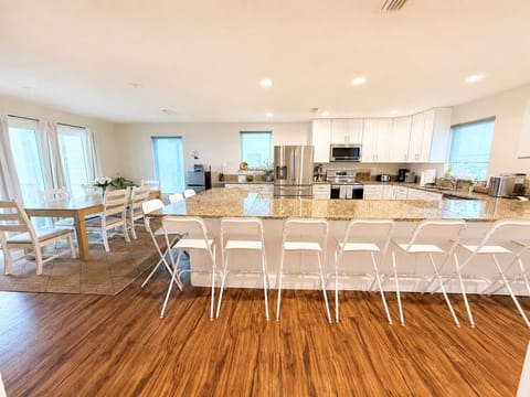 Spacious oceanfront kitchen with oversized island and seating for everyone