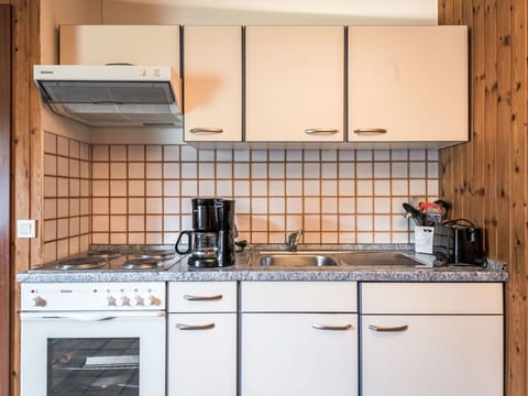 Cabinetry, Countertop, Property, Kitchen Appliance, Kitchen Stove, Gas Stove, Cooktop, Kitchen, Kitchen Sink, Home Appliance