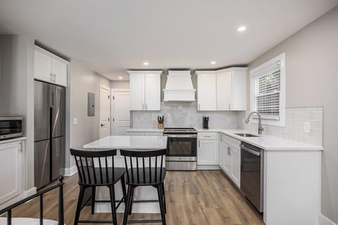 The studio kitchen offers modern amenities.