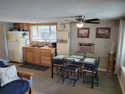 DINING AREA:  Table and chairs for 4 adults are next to the living room.